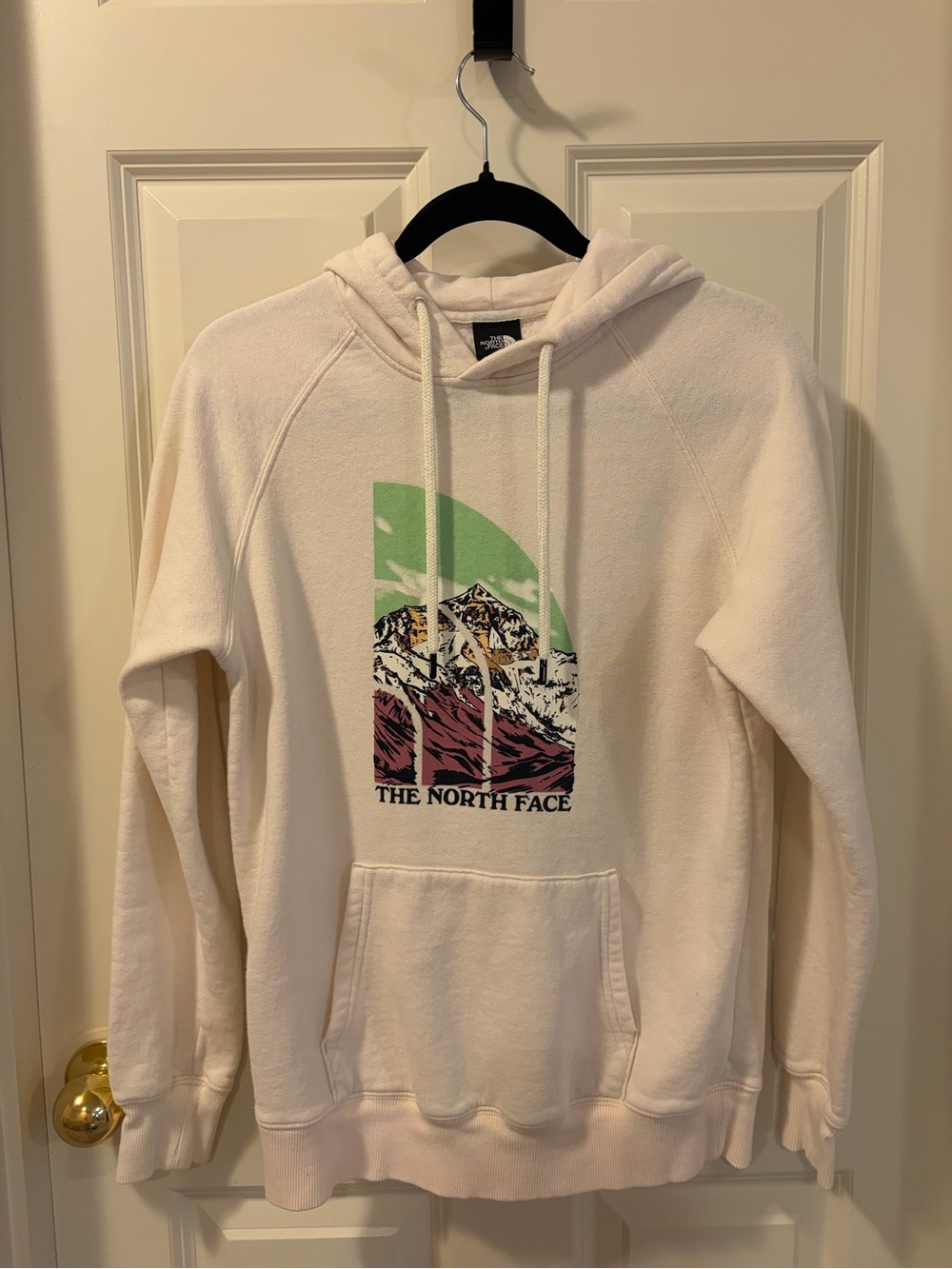 The North Face Cream Pullover Hoodie with Mountain Graphic